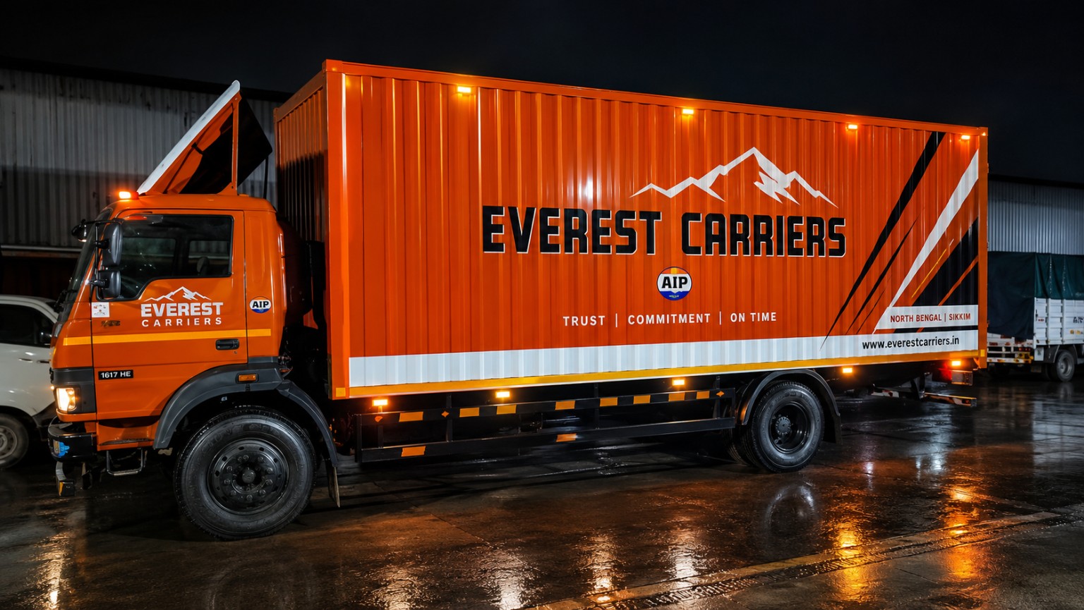 Orange Everest Carriers truck bearing Trust, Commitment, On Time branding